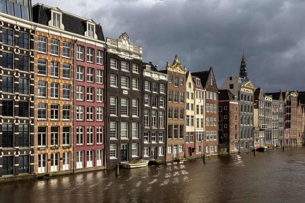 Canal houses on the Damrak, Amsterdam, at golden hour